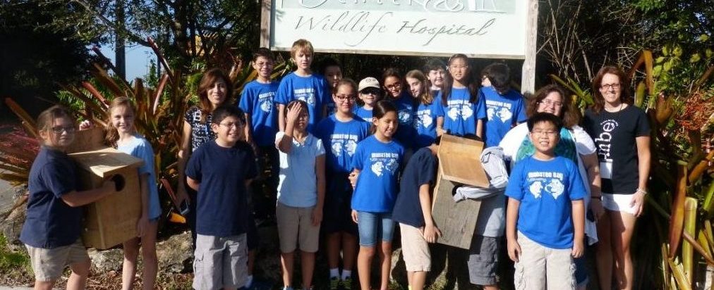 Picture from the Field Manatee Bay Elementary School of students with large birdhouses