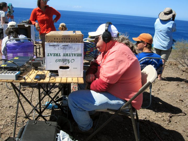 Dr. Dean Hawthorne listening for whales in Hawaii