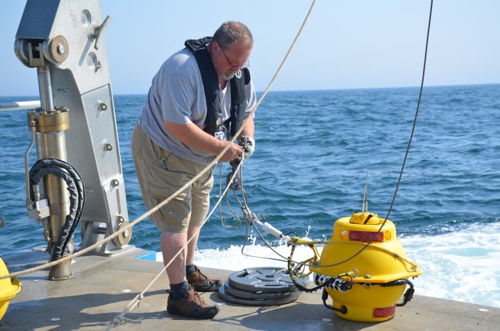 Captain Fred Channell deploying a Marine Autonomous Recording Unit (MARU). 