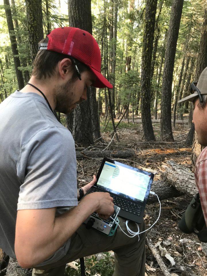 Connor Wood checking the recording settings on a SWIFT unit.