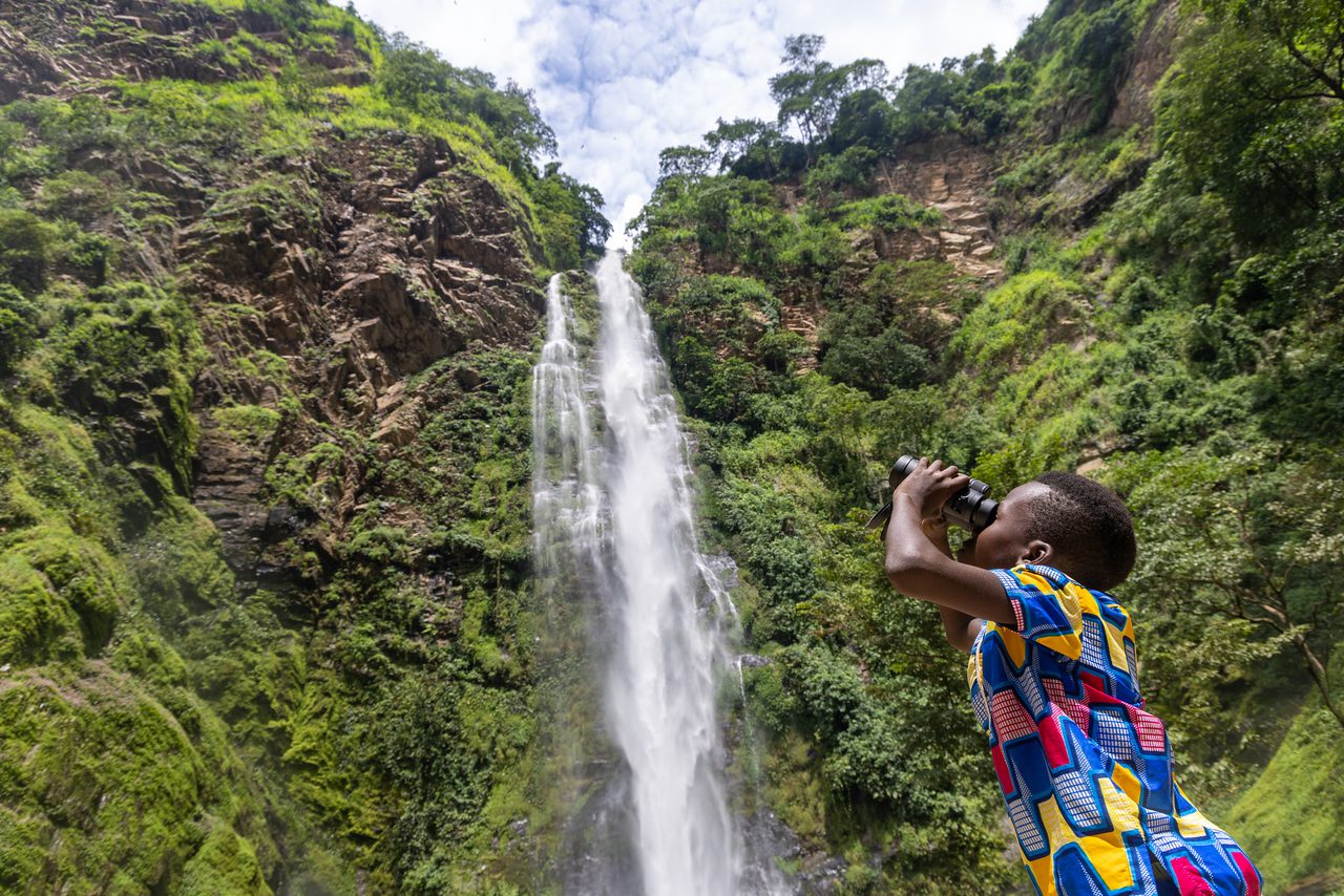 Ghanaian student using binoculars