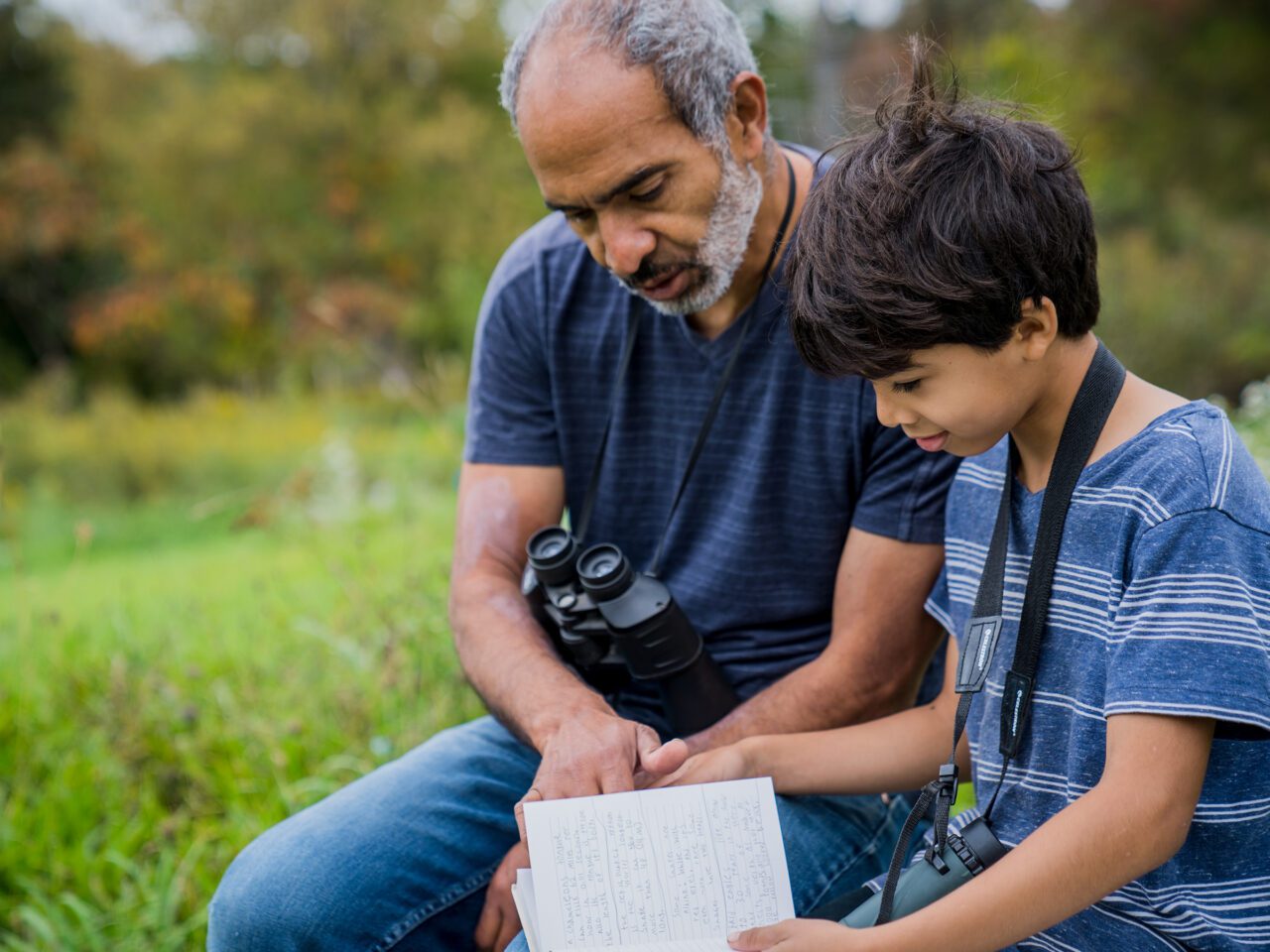 Parent and child learning about birds together.