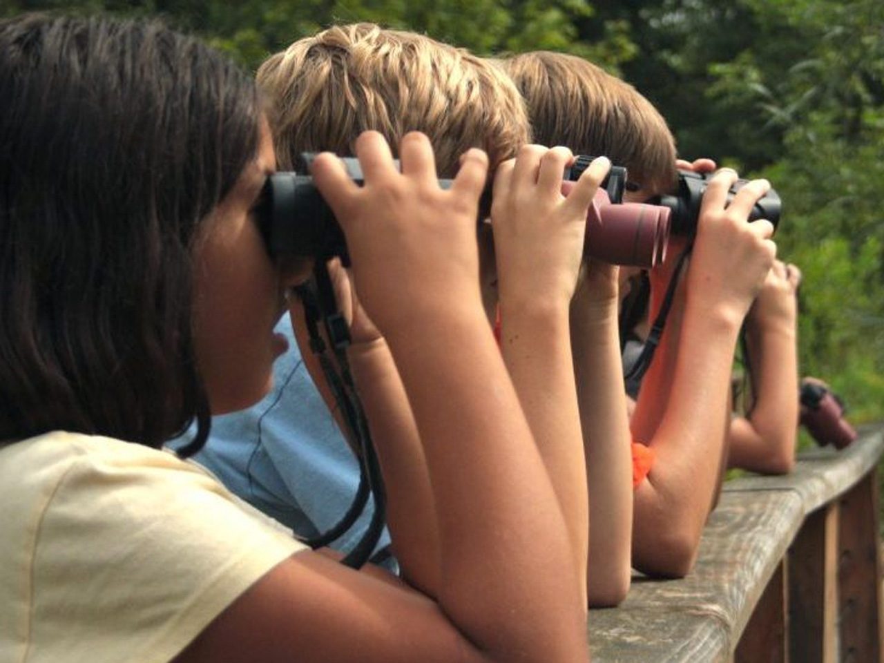Kids looking through binoculars