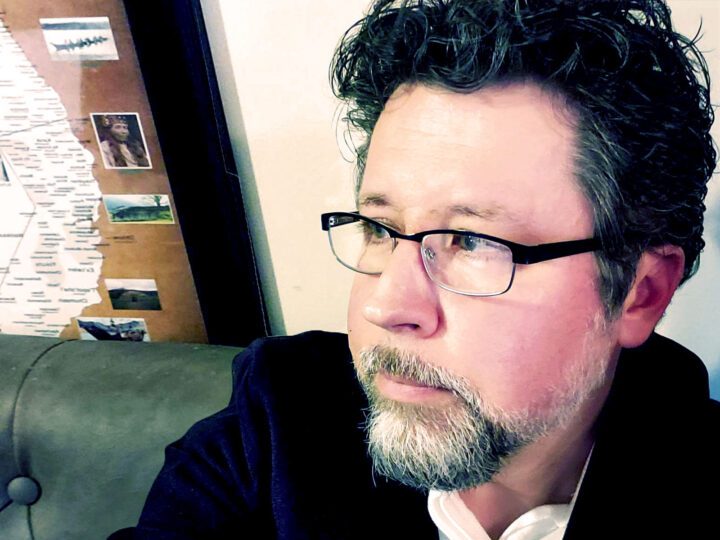 Man with glasses and a salt and pepper beard.