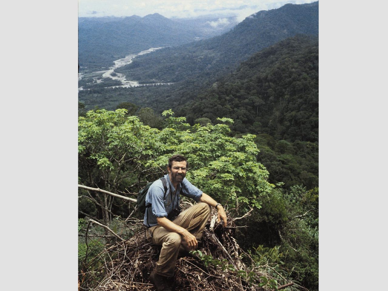John Fitzpatrick on mountaintop in Peru overlooking river valley