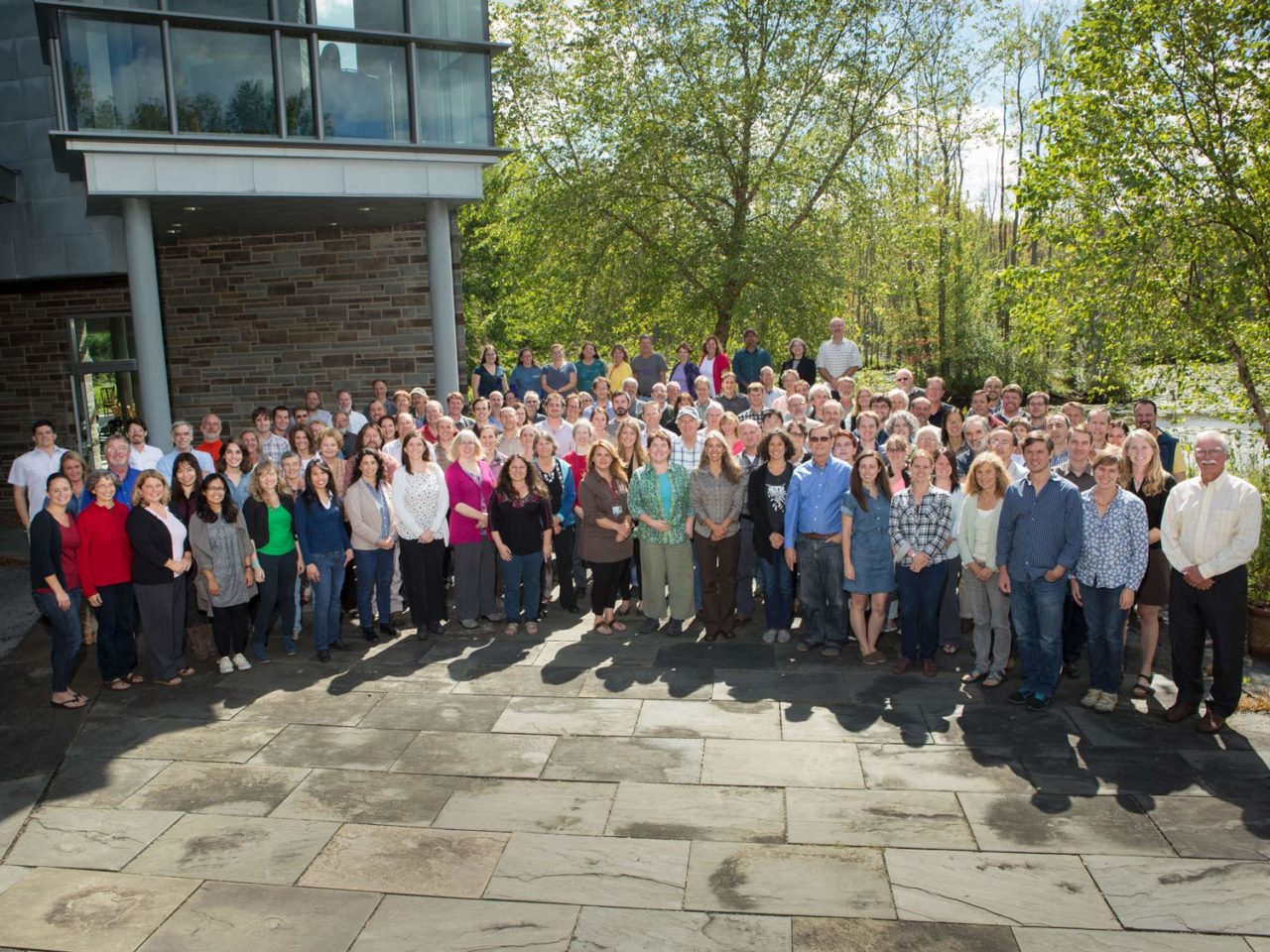most of the Cornell Lab staff gather on the patio outside the Cornell Lab offices