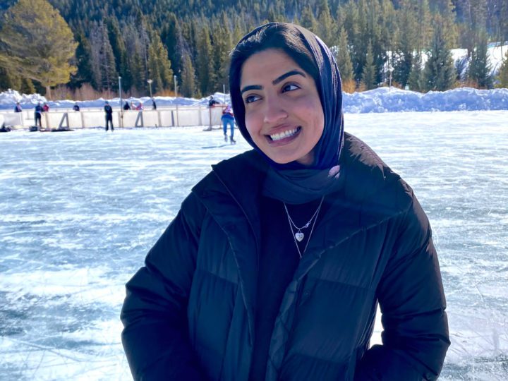 Maryam Zafar standing in front of an ice rink