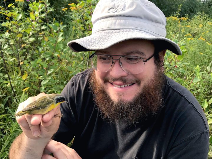 Nicholas Sly holding a bird