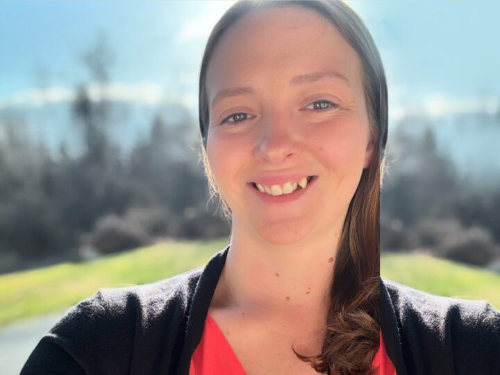 Michelle looking at the camera, smiling.