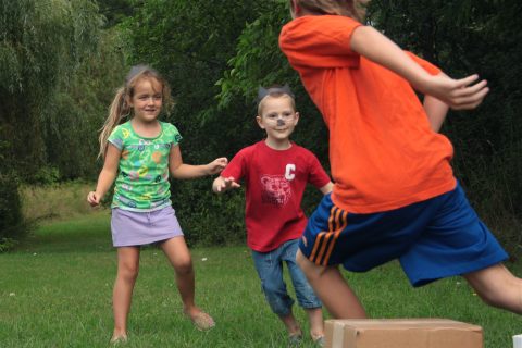 Kids playing migration obstacle