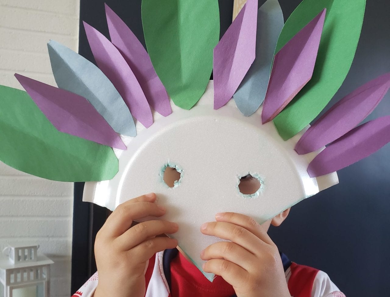 Child's hands-on bird mask