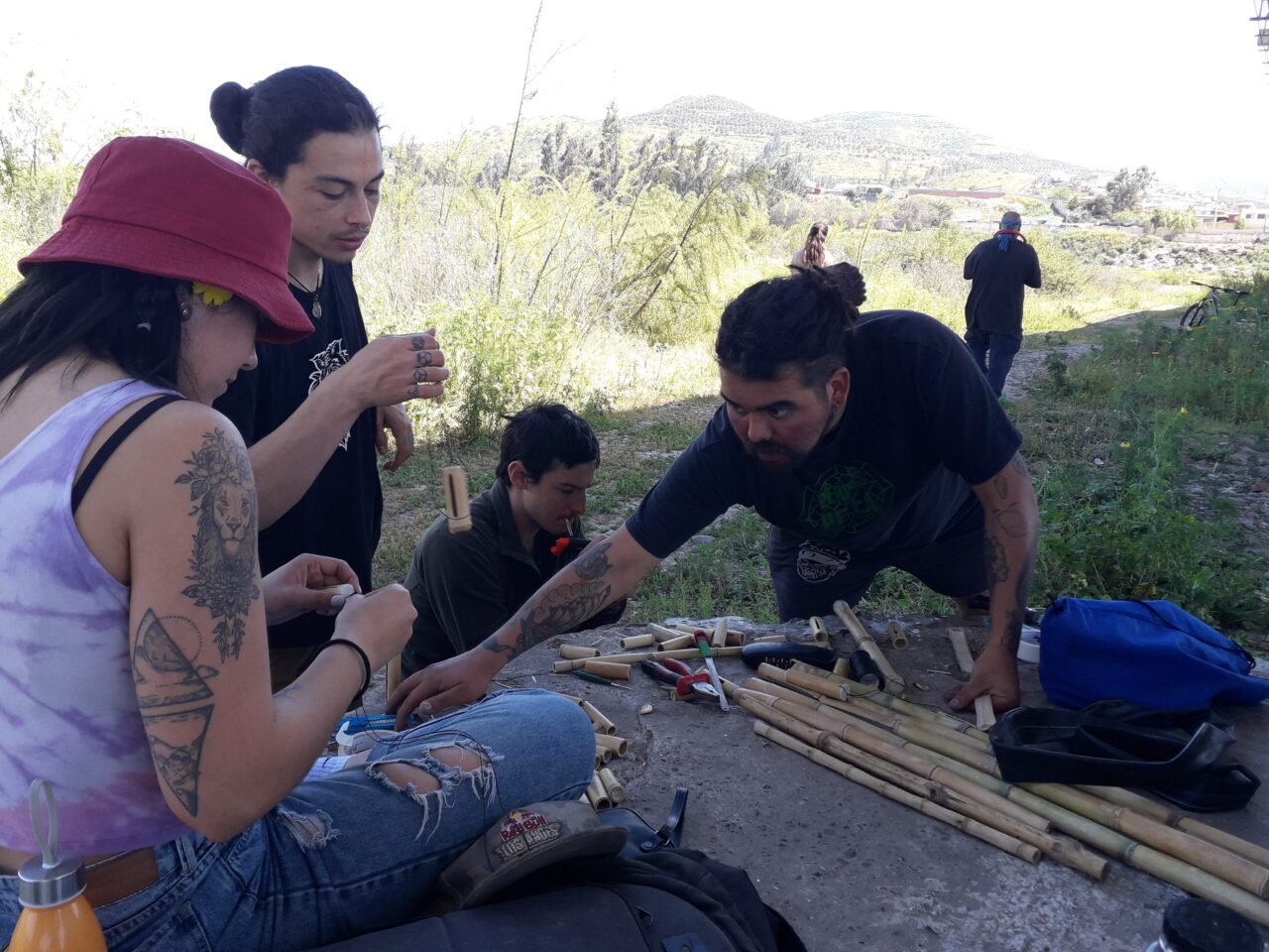A group of people making birding instruments
